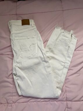 American Eagle Outfitters White High-Rise Skinny Jeans with Raw Hem